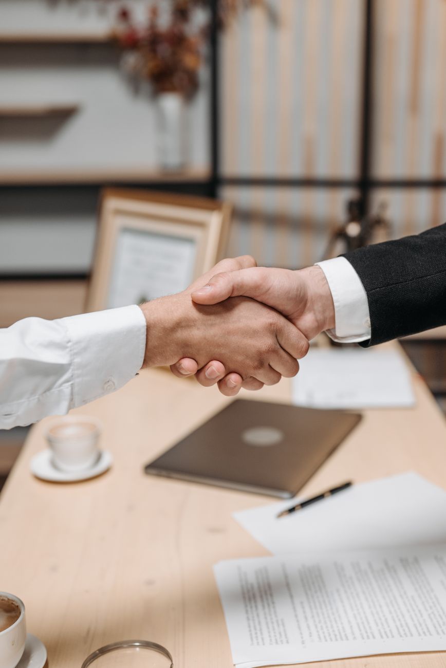 photo of people shaking hands